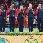 USA womens gymnastics team on gold medal podium